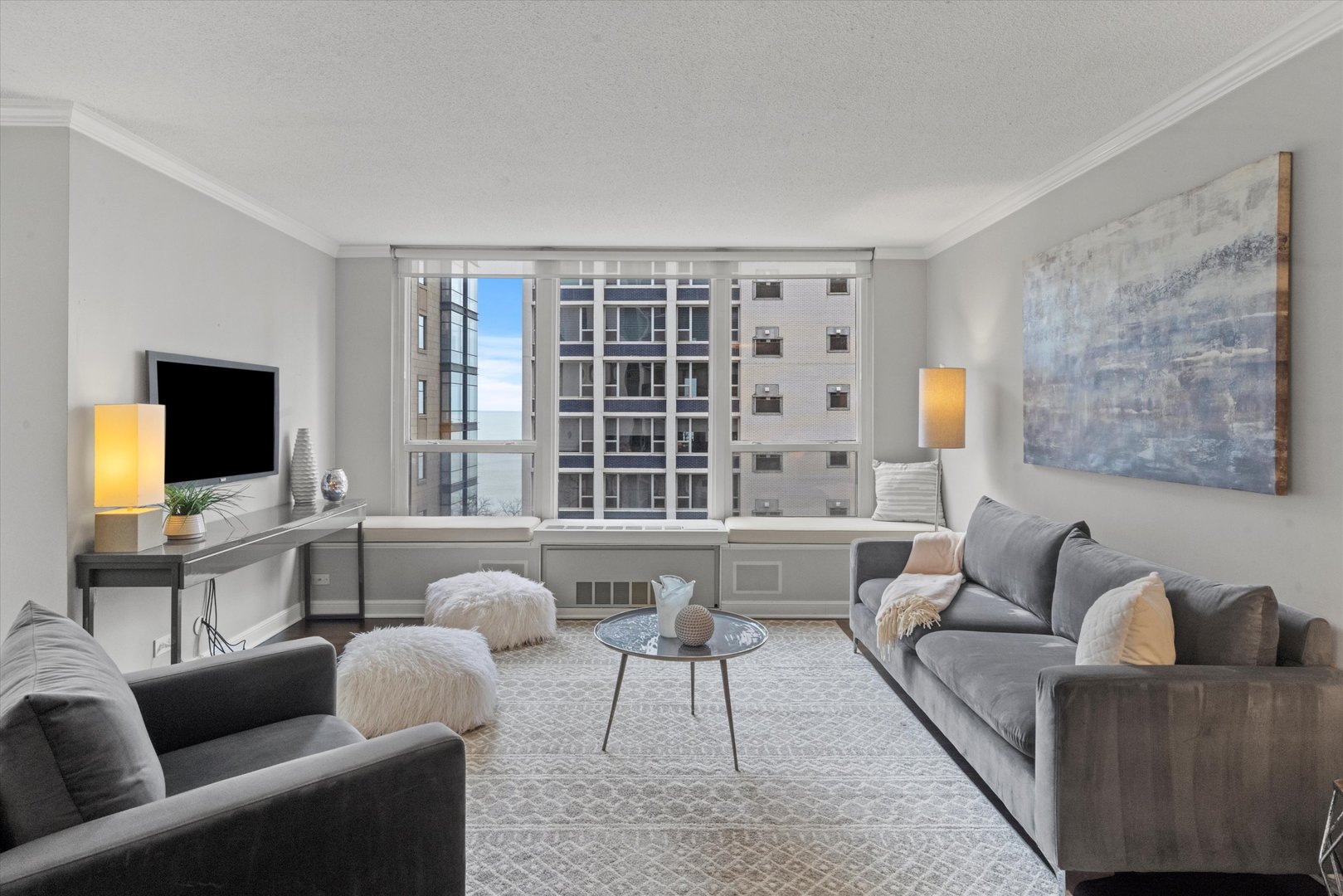 1313 North Ritchie Court, Unit 805 Chicago, IL 60610 - Photo 6 of 21 a living room with furniture and a flat screen tv