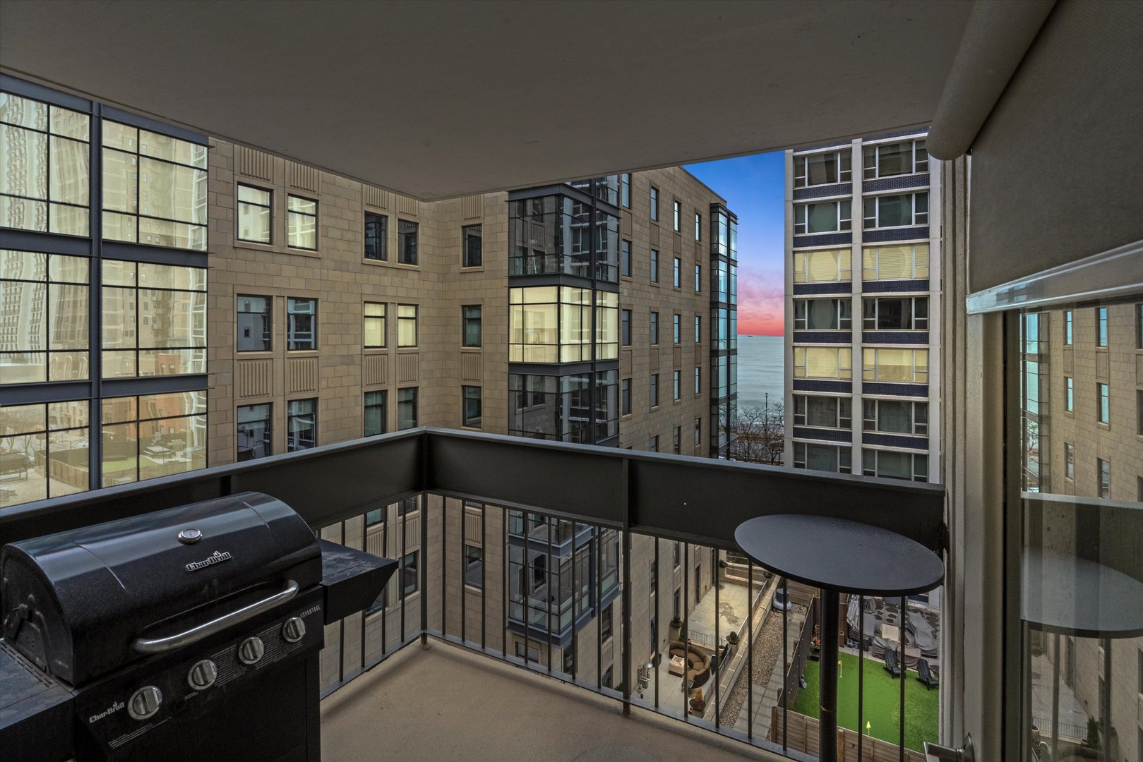 1313 North Ritchie Court, Unit 805 Chicago, IL 60610 - Photo 9 of 21 a view of a balcony with chairs and a potted plant