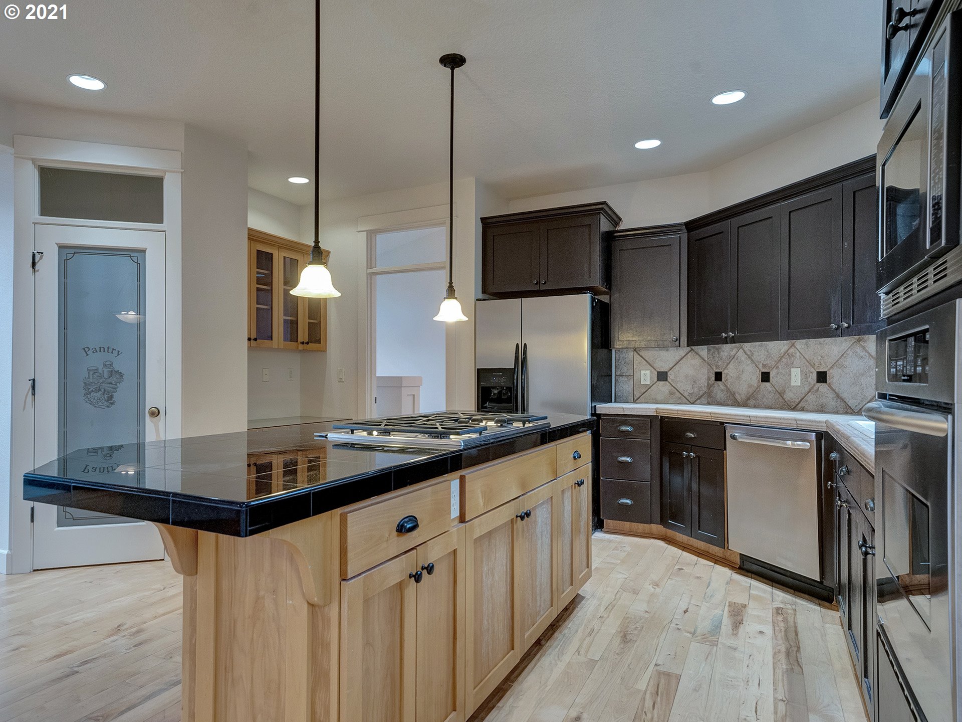10248 Southeast Nicole Loop Happy Valley, OR 97086 - Photo 12 of 32 a kitchen with stainless steel appliances a sink stove and refrigerator