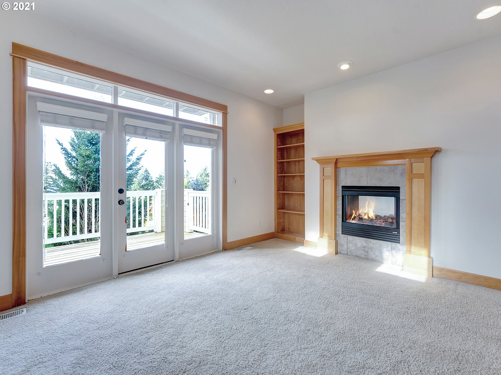 10248 Southeast Nicole Loop Happy Valley, OR 97086 - Photo 19 of 32 a view of an empty room with a fireplace and a window