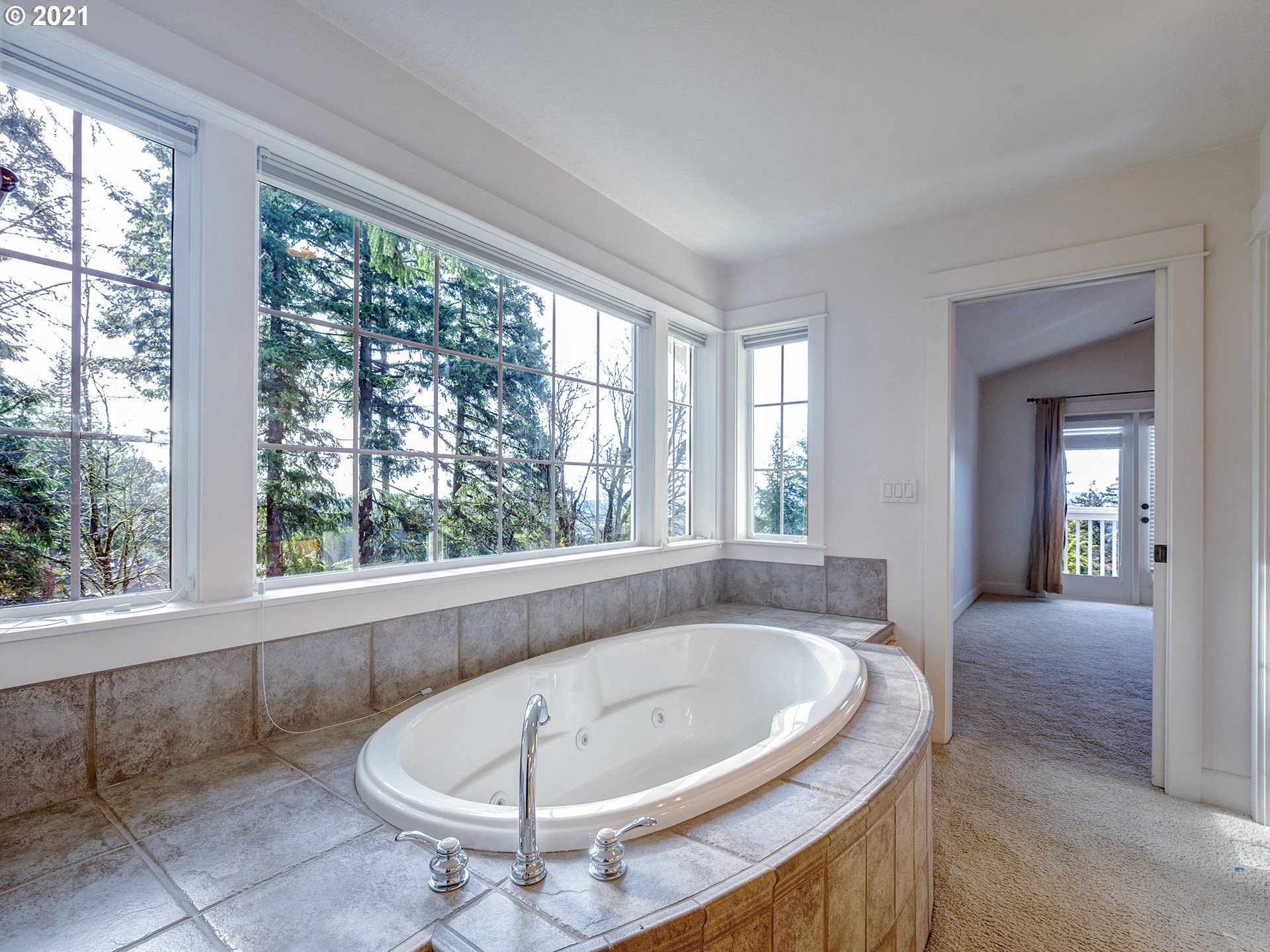 10248 Southeast Nicole Loop Happy Valley, OR 97086 - Photo 24 of 32 a view of a bath tub sitting in a room
