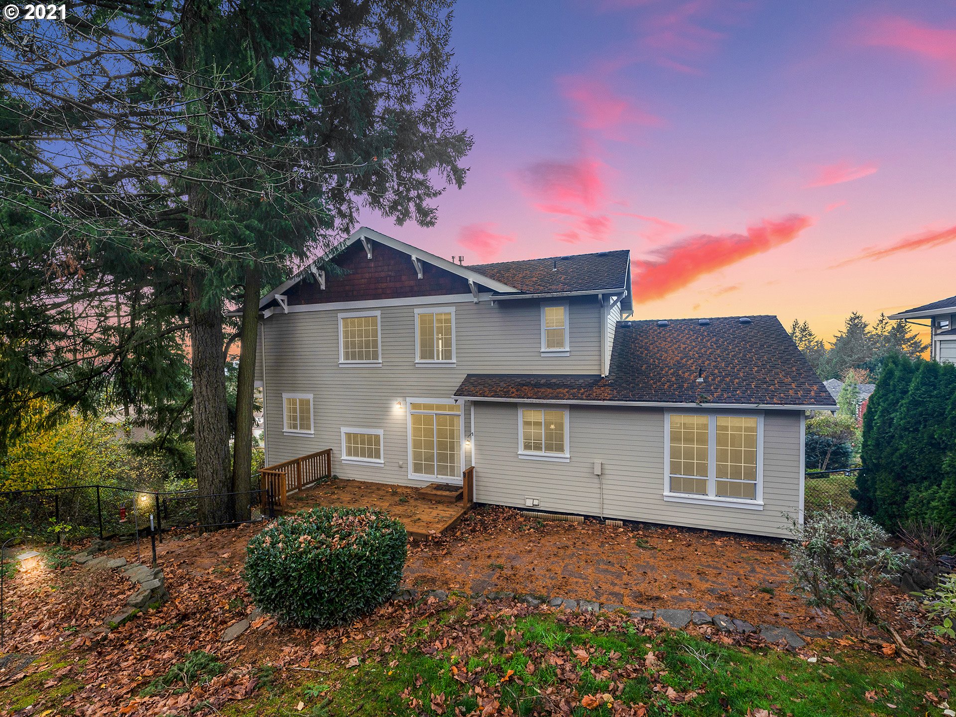 10248 Southeast Nicole Loop Happy Valley, OR 97086 - Photo 28 of 32 a front view of a house with a garden