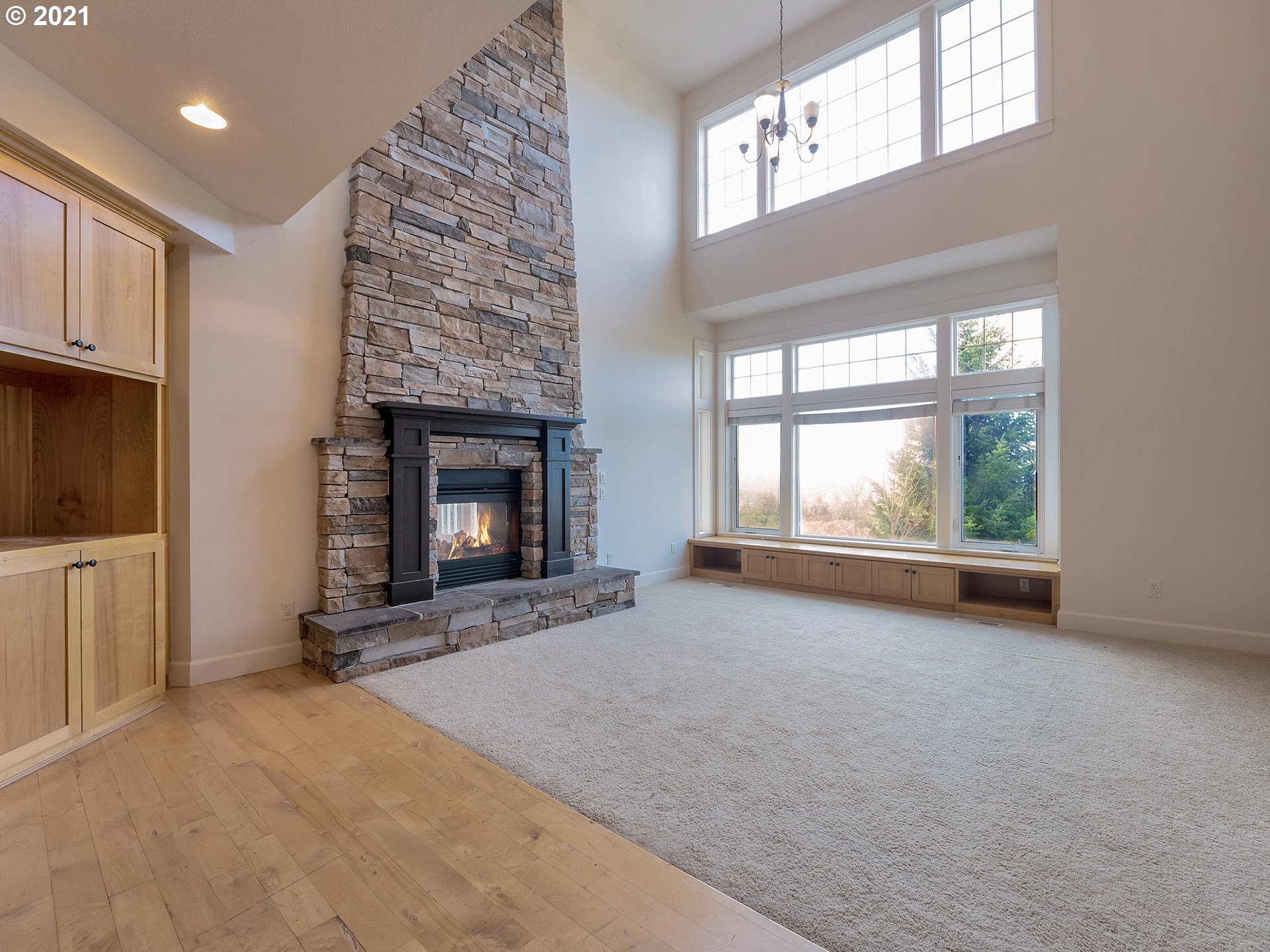 10248 Southeast Nicole Loop Happy Valley, OR 97086 - Photo 4 of 32 a view of an empty room with a fireplace and a window