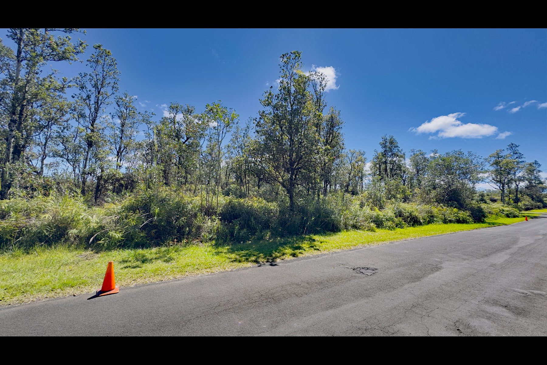 7876 Pikake Street Mountain View, HI 96771 - Photo 5 of 16 a view of an outdoor space and basketball court