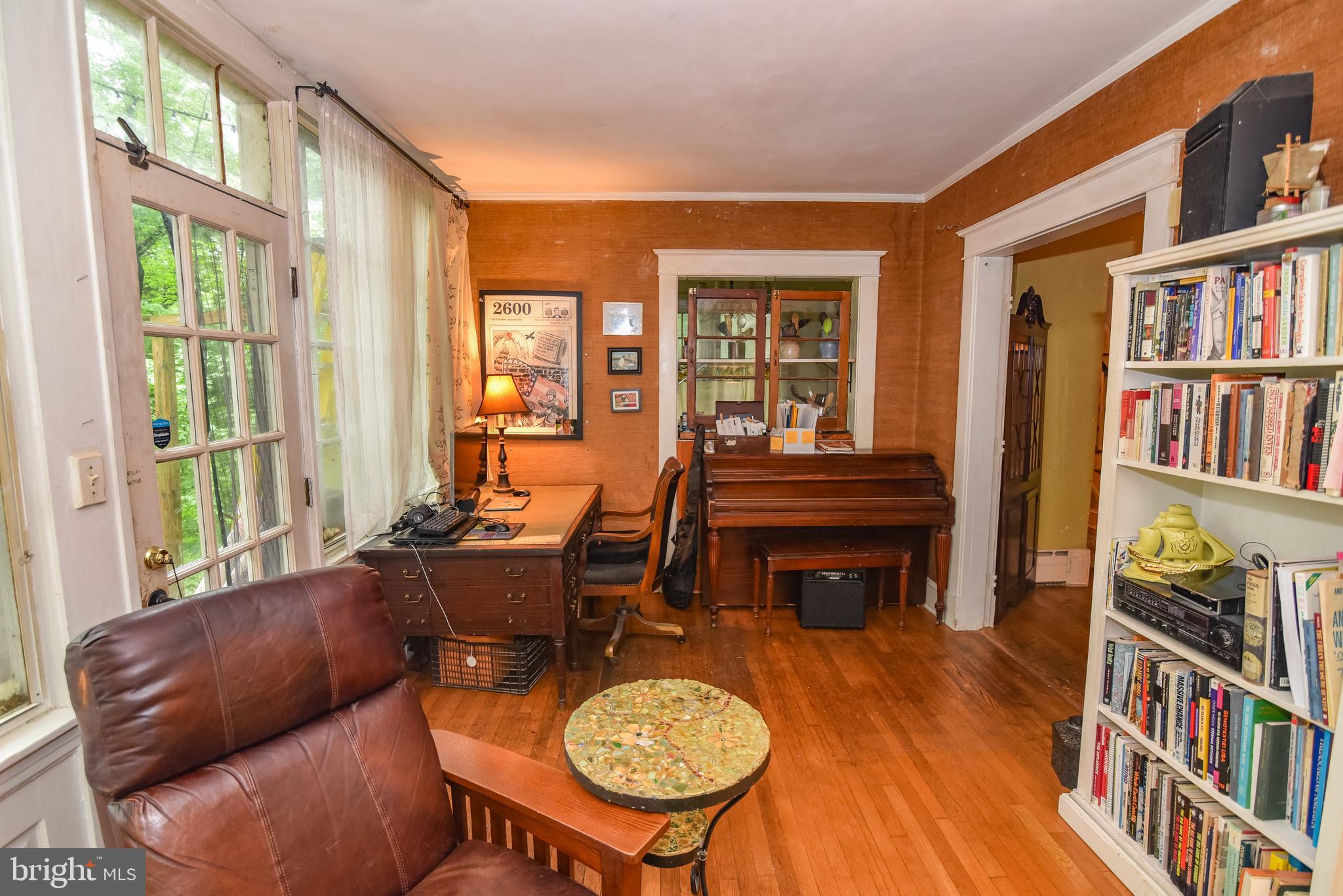 24 Merrymount Road Baltimore, MD 21210 - Photo 5 of 48 a living room with furniture a window and a book shelf