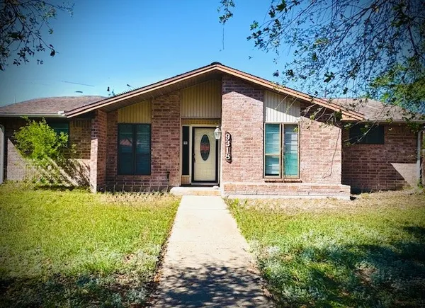 a front view of a house with yard