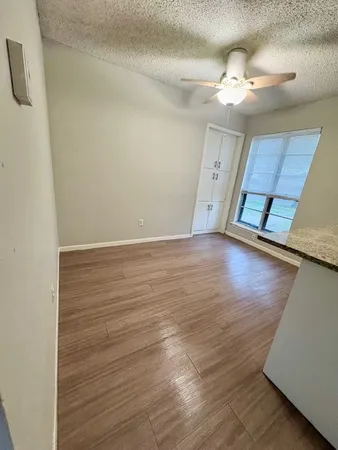 wooden floor in an empty room with a mirror