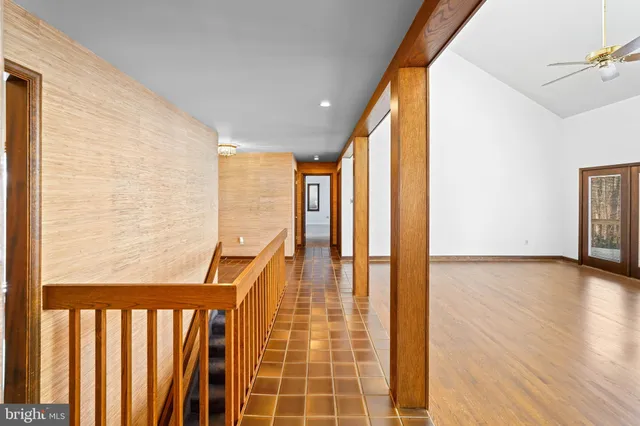 a living room with fireplace furniture and a flat screen tv