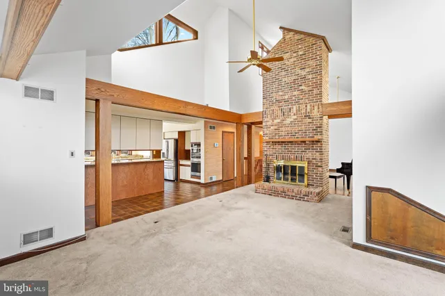 a kitchen with a large window cabinets and a counter top space