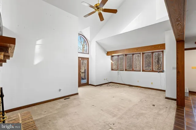 a view of kitchen island a sink dishwasher and wooden floor