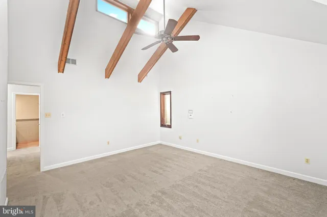 a bathroom with a tub shower and sink