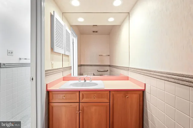 an empty room with wooden floor and a window