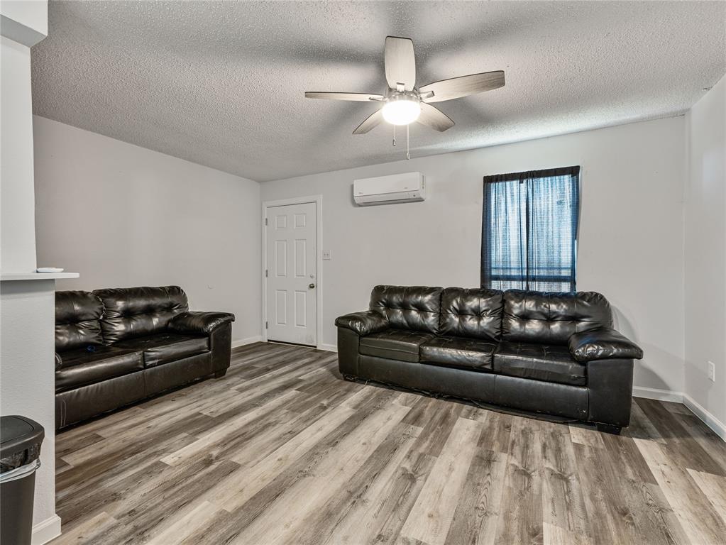 9464 Highway 180, Unit 1 Breckenridge, TX 76424 - Photo 2 of 11 a living room with a couch