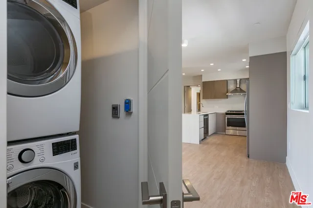 a view of a kitchen with a washer and dryer
