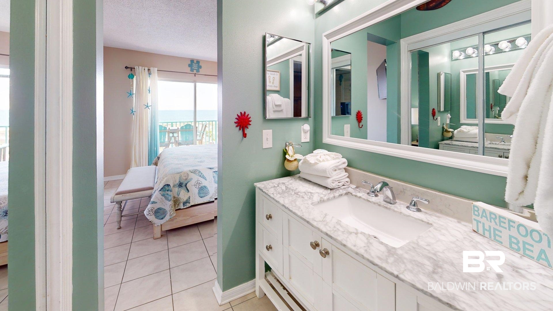 645 Plantation Road, Unit 6503 Gulf Shores, AL 36542 - Photo 3 of 53 Full bath with connected bathroom, vanity, a textured ceiling, and light tile patterned flooring
