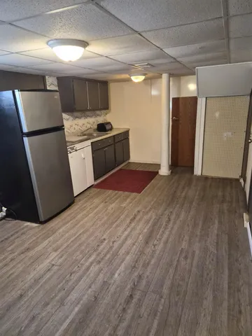 a view of a patio with a table and chairs
