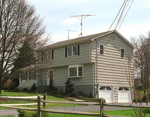 286 Mohegan Road Shelton, CT 06484 - Photo 1 of 1 a front view of a house with a yard