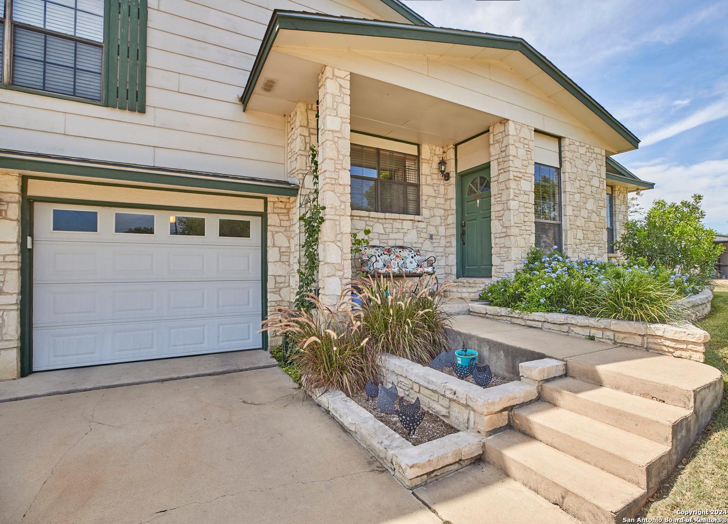 16695 Highway 16 Von Ormy, TX 78073 - Photo 1 of 1 front view of a house with a yard