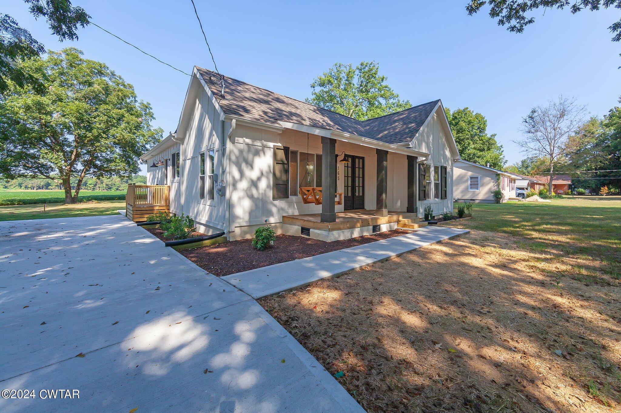 165 Mifflin Road Jackson, TN 38301 - Photo 3 of 42 a view of a house with a yard
