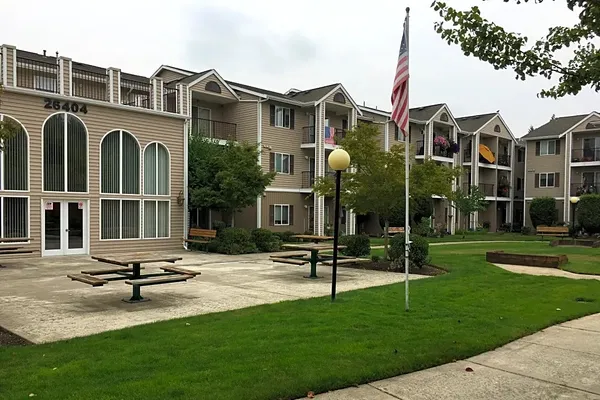 a view of a building with a yard