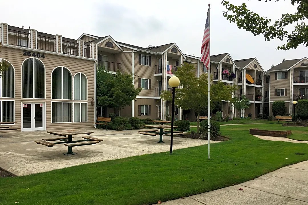a view of a building with a yard