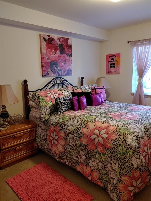 26404 104th Avenue Southeast, Unit 29 Kent, WA 98030 - Photo 13 of 13 a bedroom with a bed and a painting on the wall