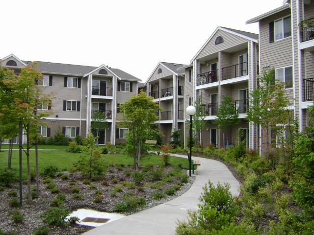 26404 104th Avenue Southeast, Unit 29 Kent, WA 98030 - Photo 6 of 13 a front view of a house with a yard