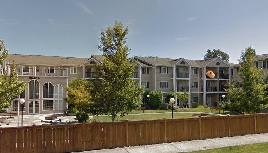 26404 104th Avenue Southeast, Unit 29 Kent, WA 98030 - Photo 9 of 13 a front view of a house with a garden