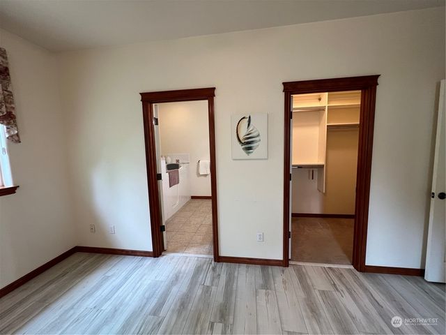 an empty room and wooden door