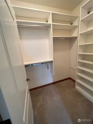a view of an empty walk in closet