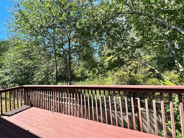 a view of balcony with wooden floor