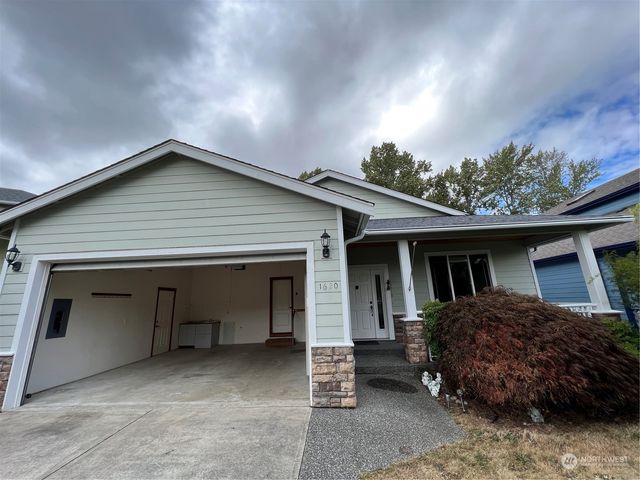 a house view with a backyard space