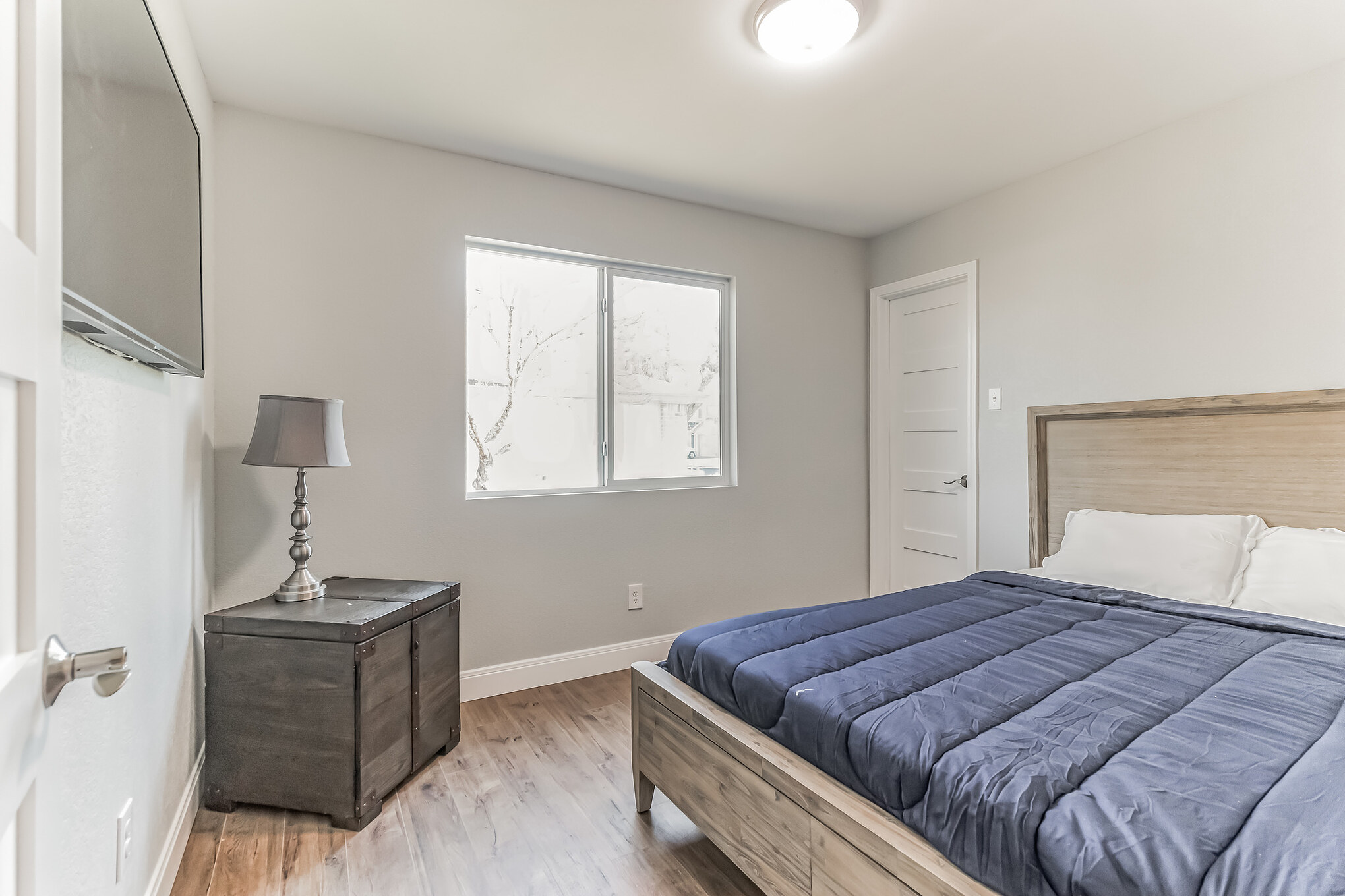 11406 Ruffed Grouse Drive Austin, TX 78758 - Photo 16 of 22 Smooth wood floors and a clean layout anchor this comfortable guest bedroom space.