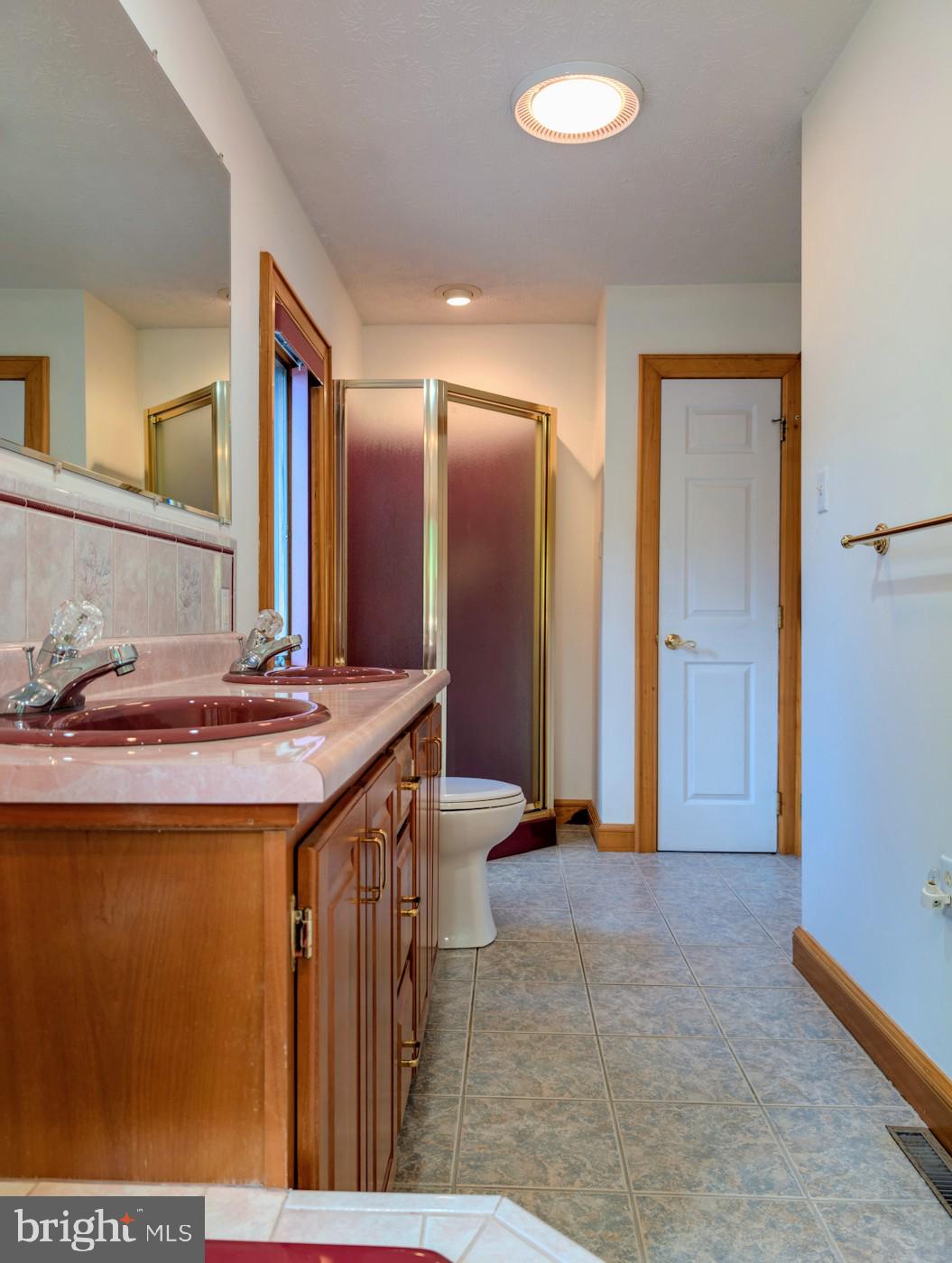 353 Pine Pitch Road Buffalo Mills, PA 15534 - Photo 30 of 83 a bathroom with a sink and a mirror