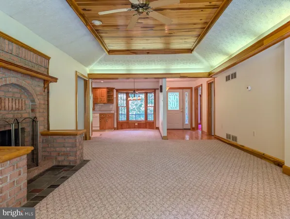 a view of staircase with a rug and a window