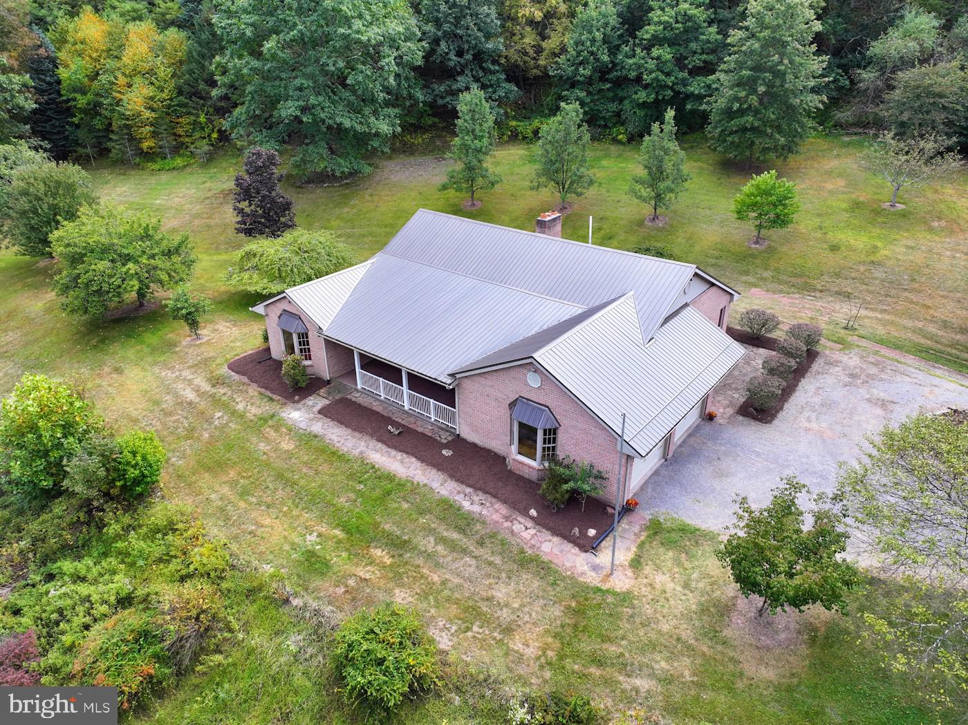 353 Pine Pitch Road Buffalo Mills, PA 15534 - Photo 9 of 83 an aerial view of a house with garden space and lake view