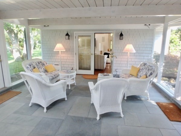 29 Naushon Road West Tisbury, MA 02568 - Photo 17 of 26 a living room with furniture and a large window