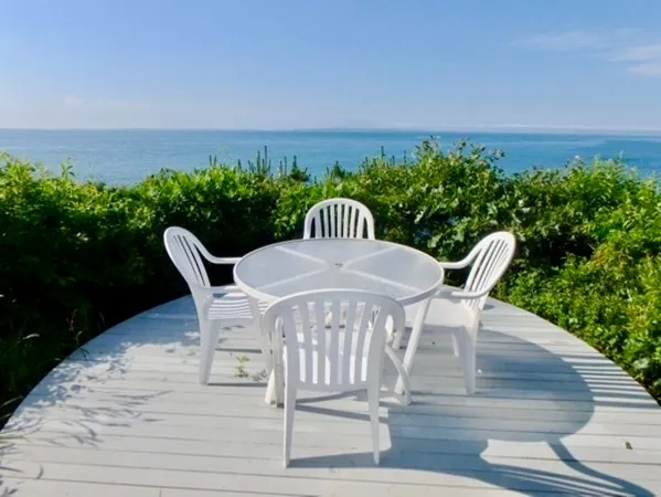 a view of a chairs and table on the terrace