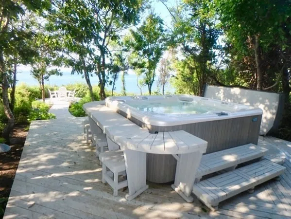 a view of a backyard with sitting area