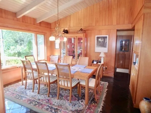 a view of a dining room with furniture window and outside view
