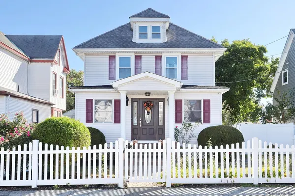 a front view of a house with a porch