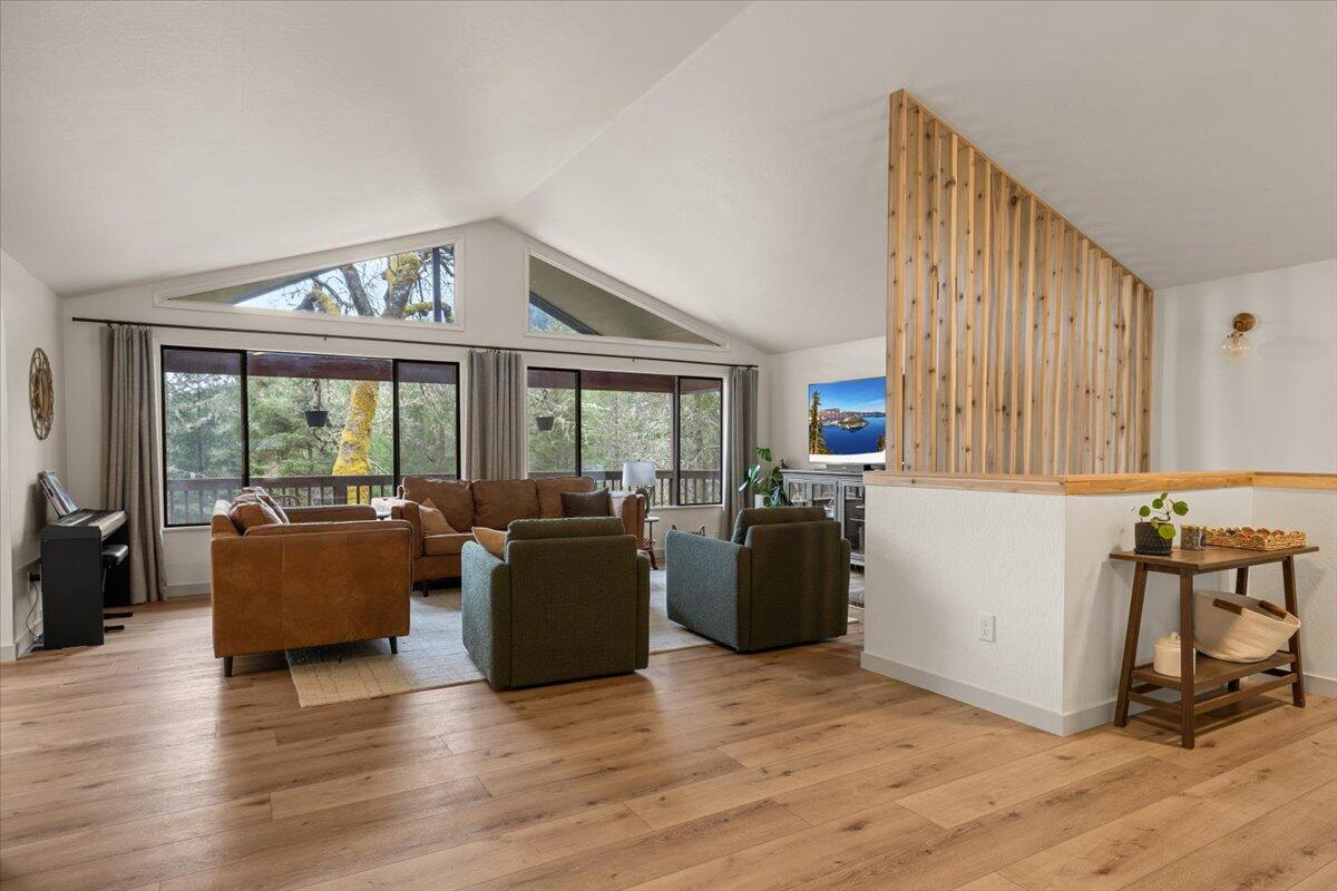 350 Splendor Drive Wilderville, OR 97543 - Photo 8 of 57 a living room with furniture and large windows