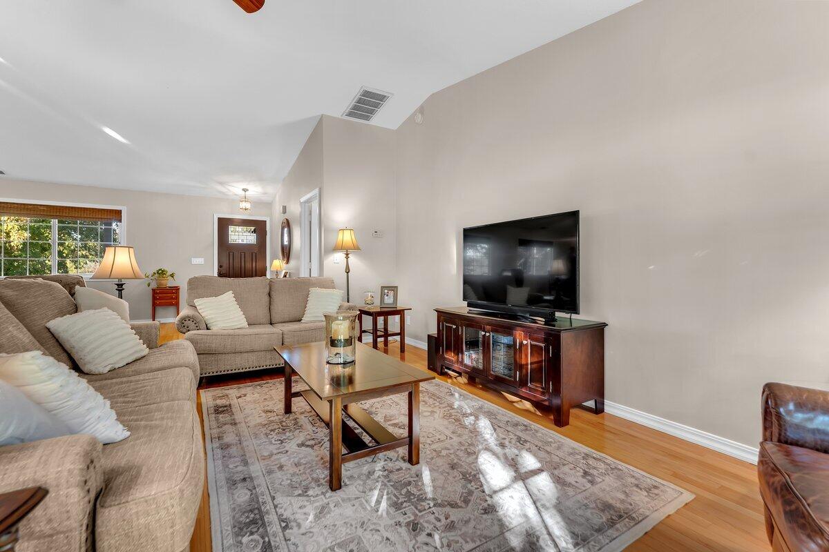 12269 Dry Creek Road Bella Vista, CA 96008 - Photo 11 of 74 a living room with furniture and a flat screen tv