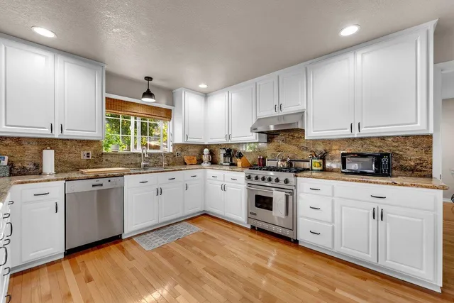 a bedroom with a bed dresser and a window