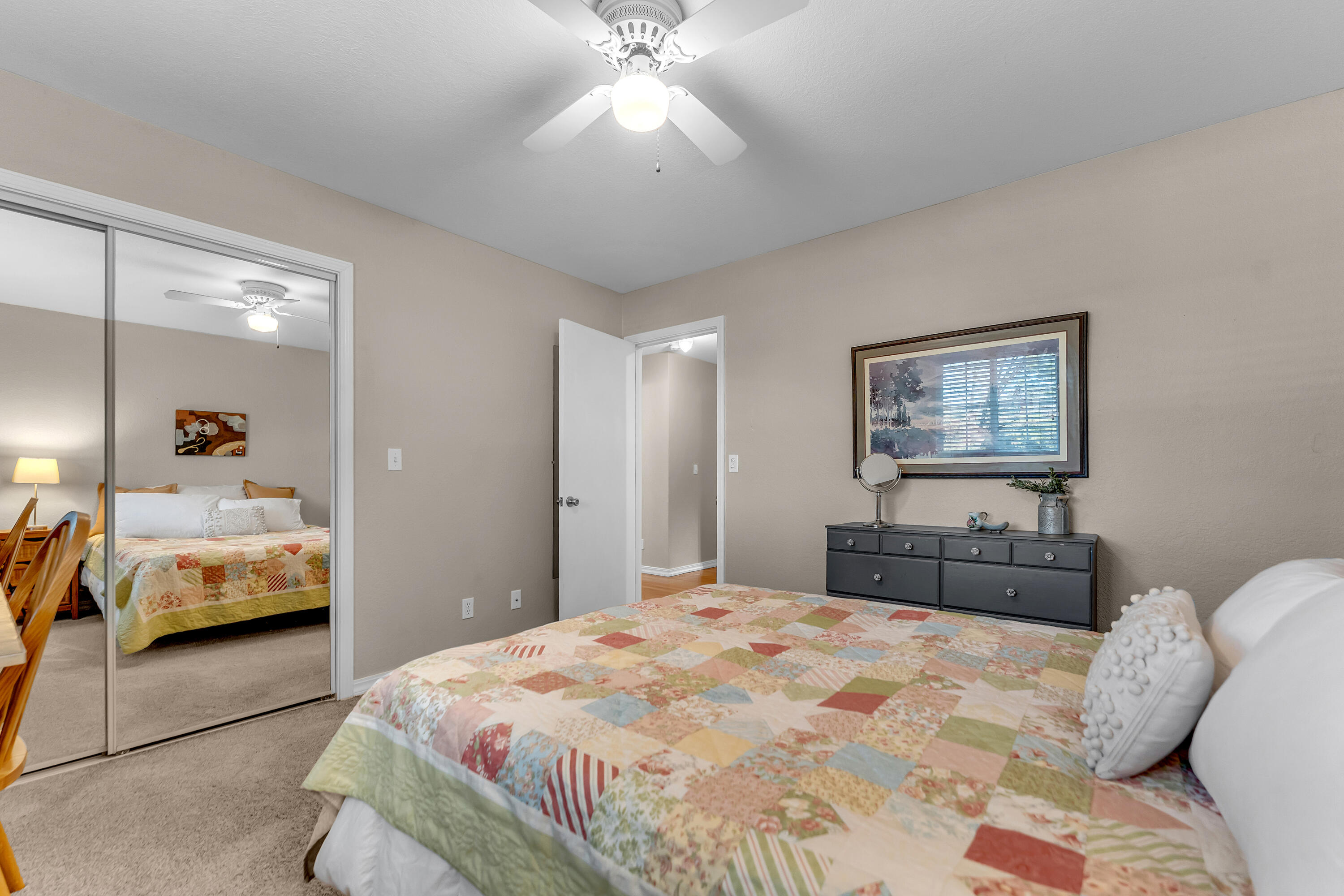 12269 Dry Creek Road Bella Vista, CA 96008 - Photo 23 of 74 a bedroom with a bed and a large mirror
