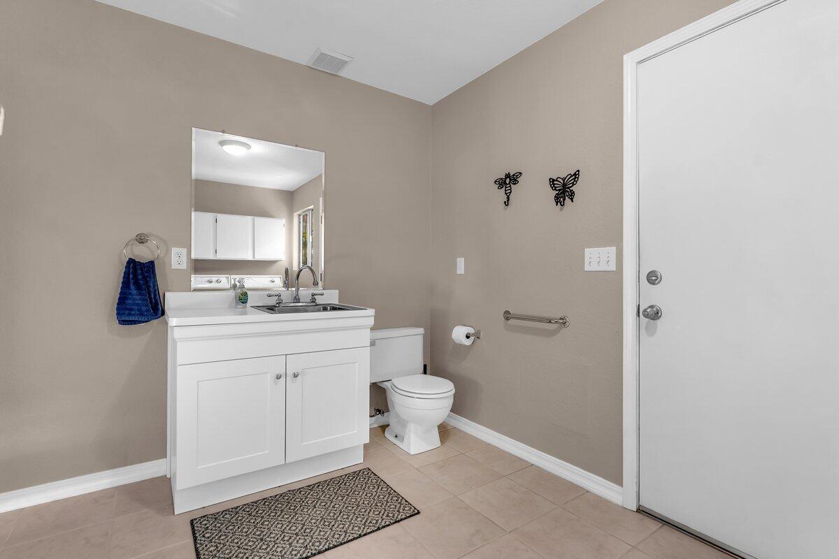12269 Dry Creek Road Bella Vista, CA 96008 - Photo 30 of 74 a bathroom with a sink a toilet and shower