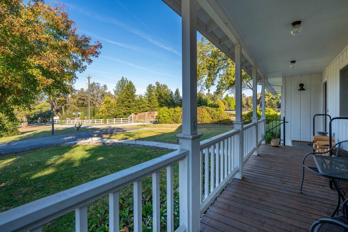12269 Dry Creek Road Bella Vista, CA 96008 - Photo 4 of 74 a view of a porch with wooden floor and outdoor space