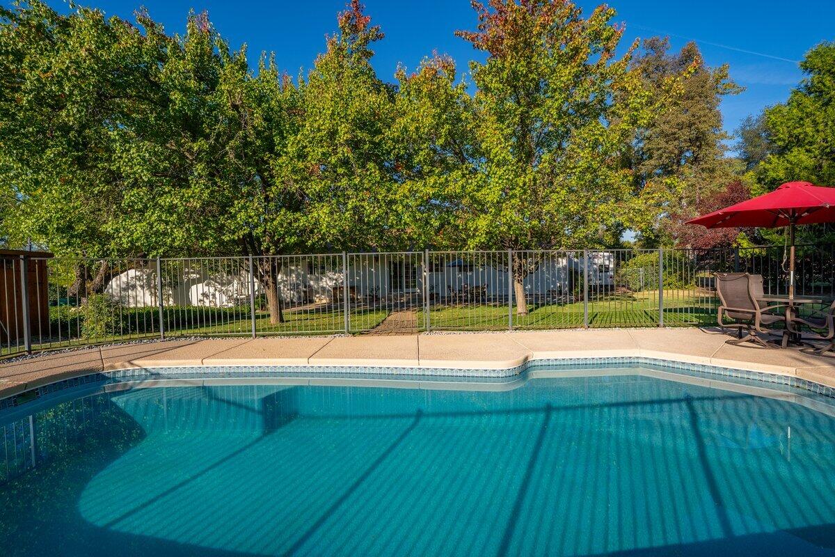 12269 Dry Creek Road Bella Vista, CA 96008 - Photo 45 of 74 a view of a swimming pool with a patio