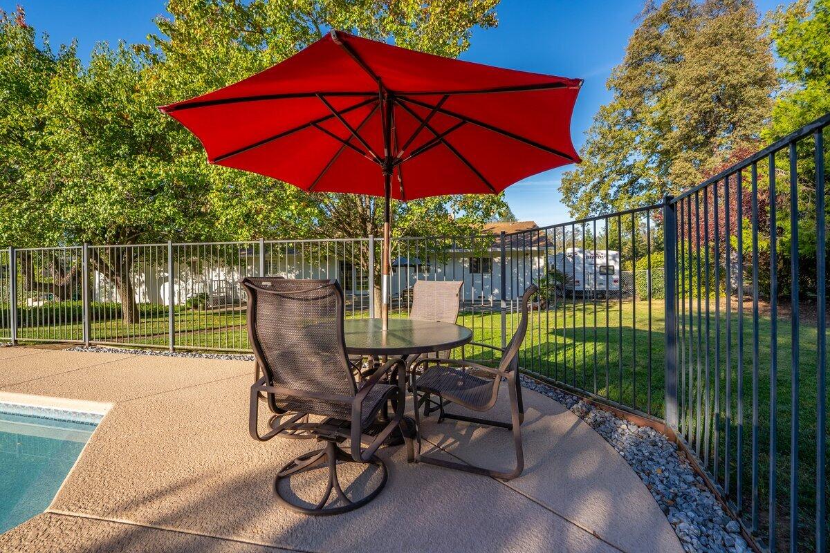 12269 Dry Creek Road Bella Vista, CA 96008 - Photo 46 of 74 a view of a chair and table on the patio