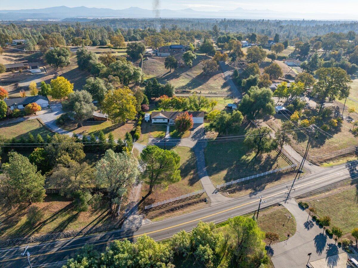 12269 Dry Creek Road Bella Vista, CA 96008 - Photo 52 of 74 an aerial view of residential houses with outdoor space